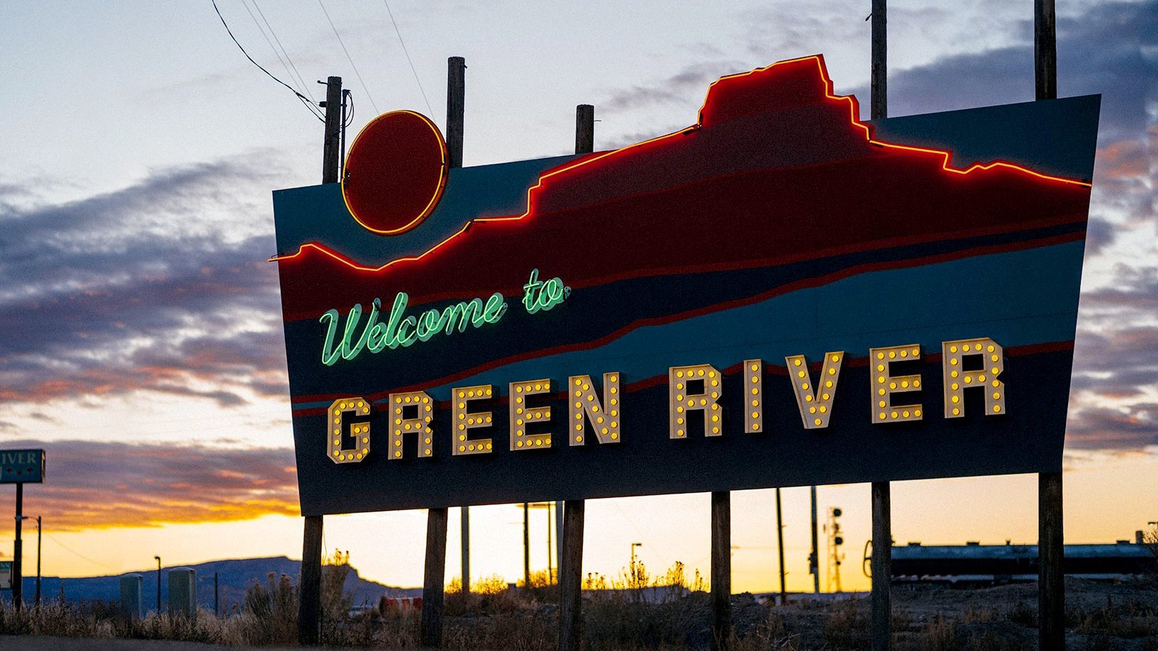 The Green River Welcome Sign at sunrise. Photo by John Watson