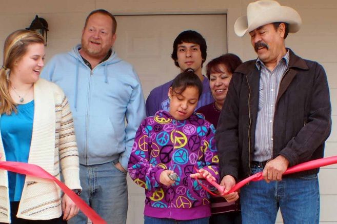 The Mendozas cut the ribbon on their new home, built by Epicenter and Habitat for Humanity